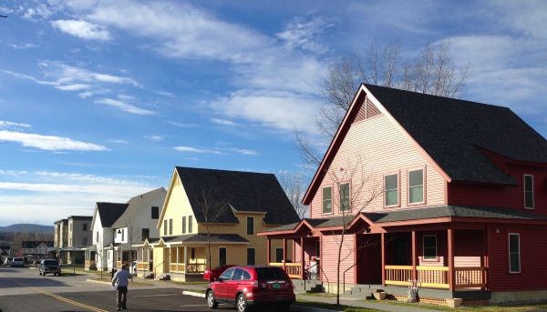 Red, yellow, and white houses along a Vermont road