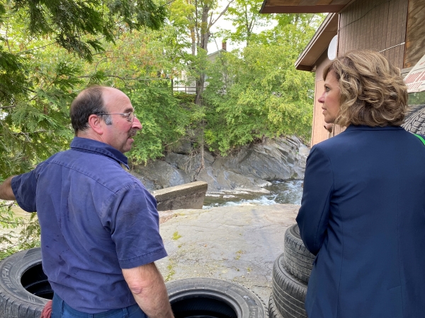 Mike and Sec. Kurrle inspect damage