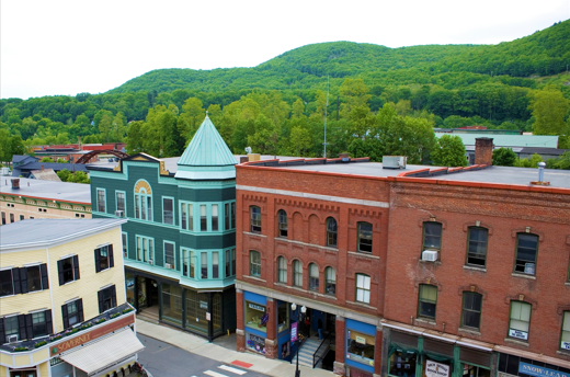 Vermont Downtown - Brick, yellow and blue building line a street