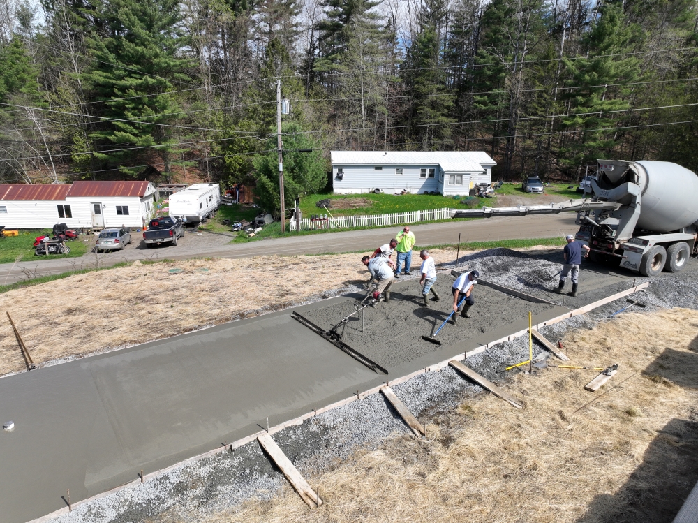 men pouring concrete