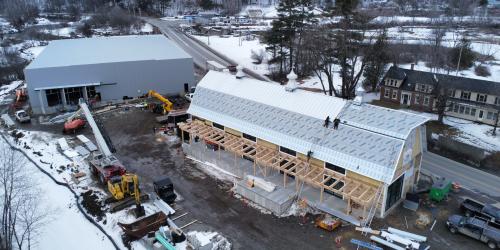 Aerial shot of barn and warehouse under construction